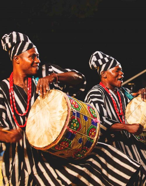 Two drummers playing african drum